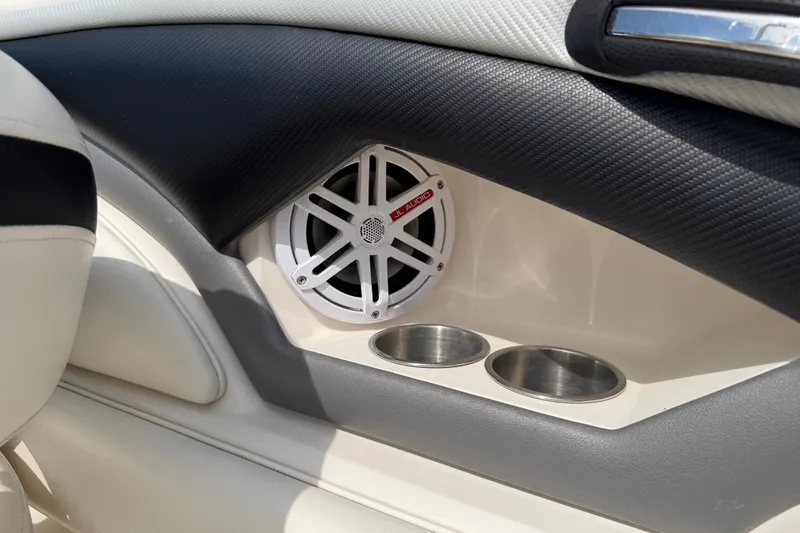 Slide: The Image of Interior of 2009 Monterey 234FS boat featuring JL Audio speaker and dual cup holders. - 28