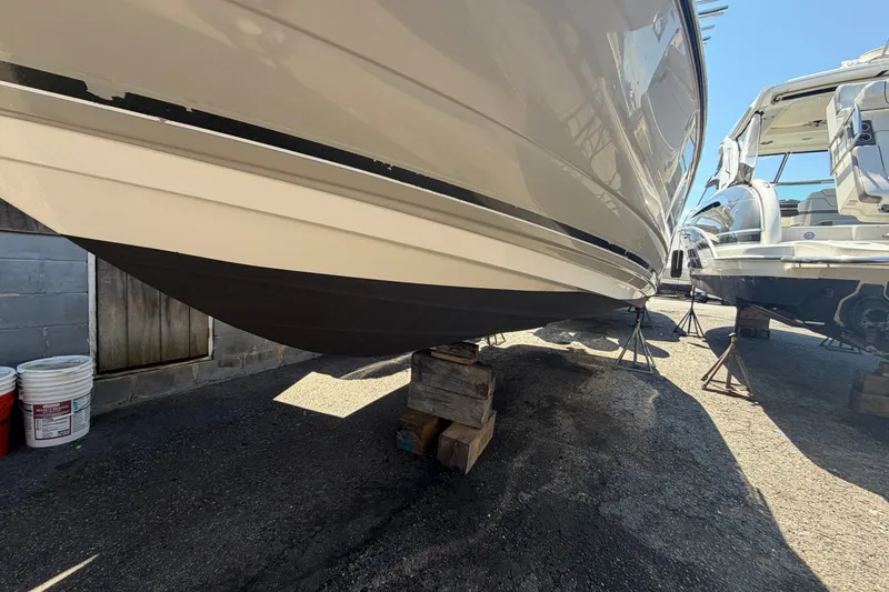 Slide: The Image of 2009 Monterey 234FS boat on stands, hull view in a boatyard. - 41