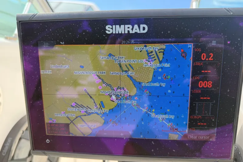 Slide: The Image of Simrad marine GPS display showing navigation map on a 2009 Monterey 234FS boat. - 33