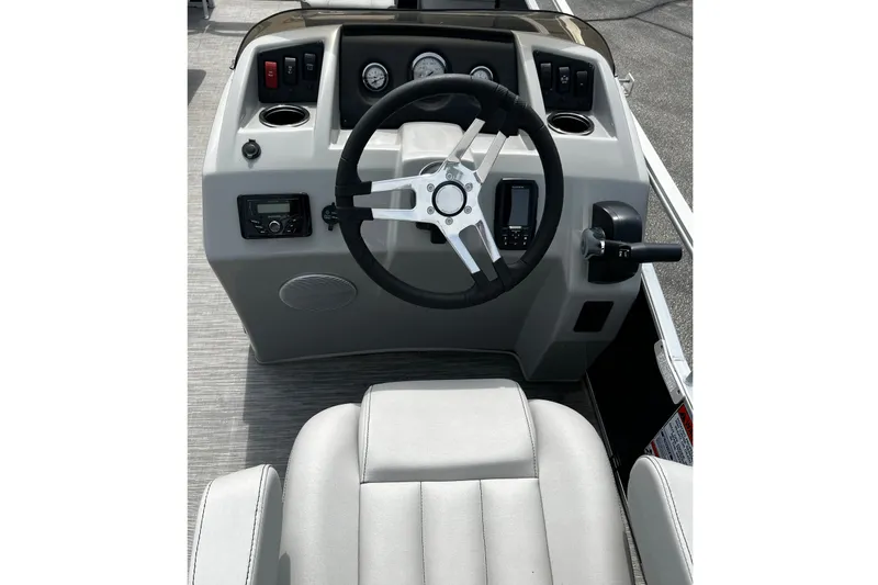 Slide: The Image of 2023 Bennington 20 SF boat dashboard with steering wheel and controls. - 6