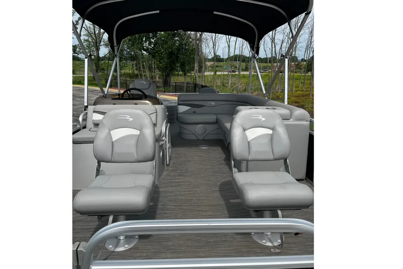 Slide: The Image of 2023 Bennington 20 SF pontoon boat interior with gray seating and canopy. - 8