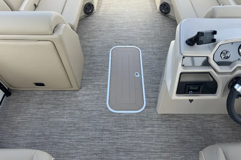 Slide: The Image of Interior of 2027 Godfrey Xperience 23' Split Bench with beige seating and control panel. - 16