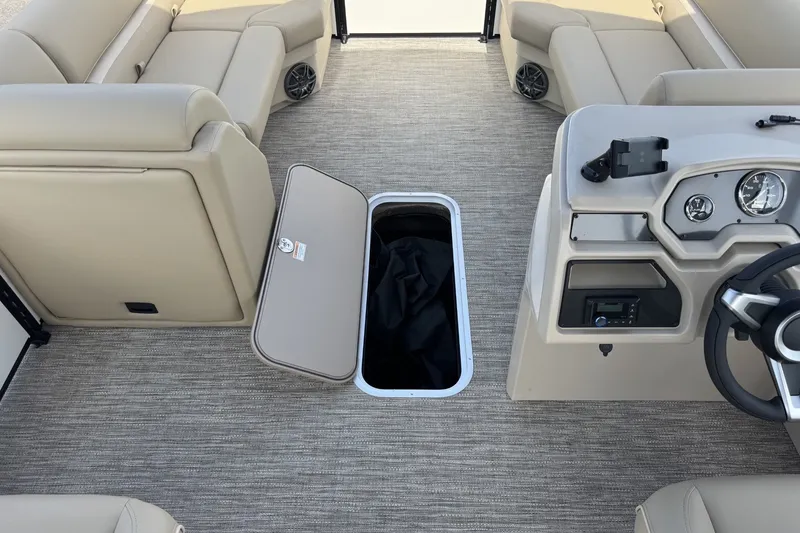 Slide: The Image of 2027 Godfrey Xperience 23' Split Bench interior with open storage compartment. - 17