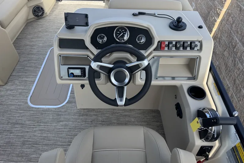 Slide: The Image of Steering console of 2027 Godfrey Xperience 23' Split Bench boat, featuring modern controls and gauges. - 14