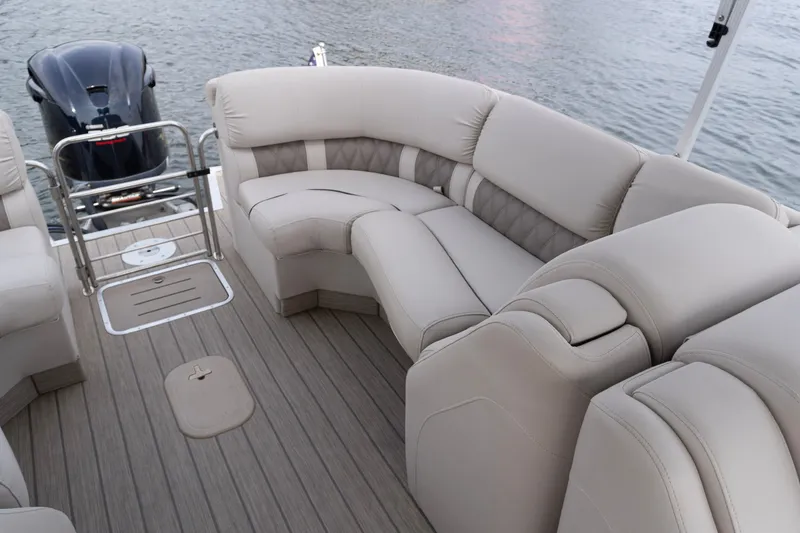 Slide: The Image of Luxurious seating on a 2017 Bennington R25 pontoon boat with sleek design and modern features. - 24