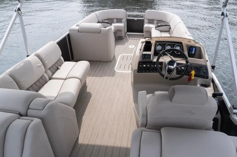 Slide: The Image of Luxurious interior of a 2017 Bennington R25 pontoon boat on the water. - 6
