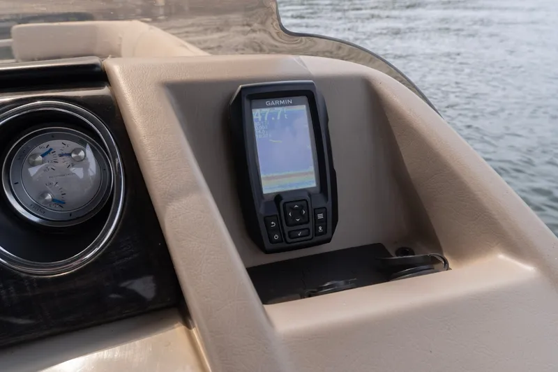 Slide: The Image of Dashboard of a 2017 Bennington R25 boat featuring a Garmin GPS device. - 9