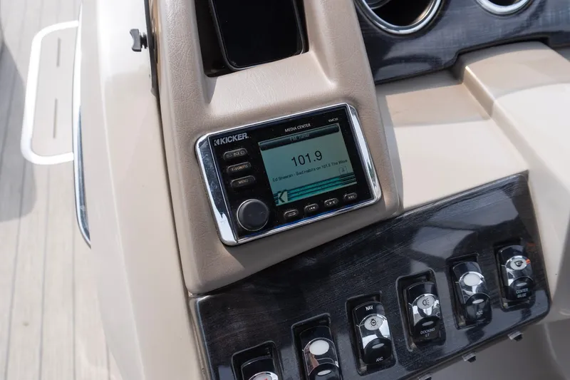 Slide: The Image of Dashboard of a 2017 Bennington R25 boat featuring a Kicker media center. - 8