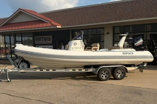 The Image of 2020 Brig Eagle 6.7 boat on trailer outside dealership. - 1