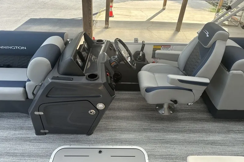 Slide: The Image of 2027 Bennington 22 SSR boat interior with modern helm and comfortable seating. - 3