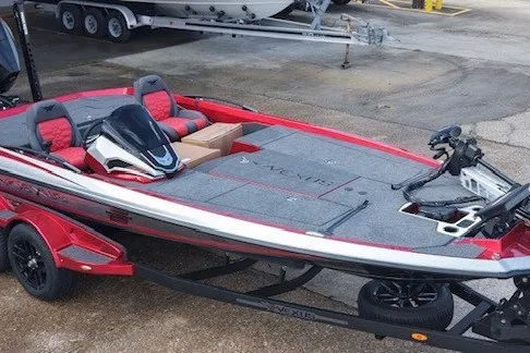 The Image of 2026 Vexus VXs20 boat in red and gray, parked on a trailer. - 1