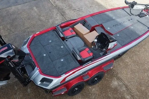 Slide: The Image of 2026 Vexus VXs20 boat with red and gray interior, dual seats, and modern design. - 5
