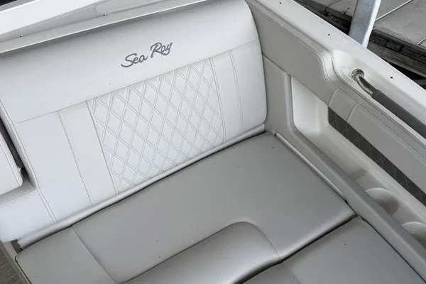 Slide: The Image of White leather seating on 2022 Sea Ray SLX 310 boat, featuring diamond stitching. - 17