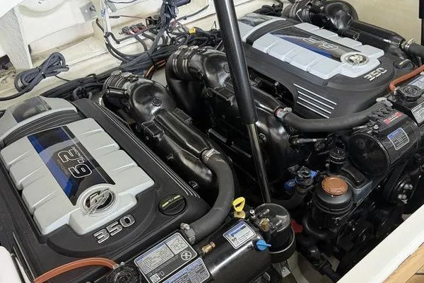 Slide: The Image of Twin engines of a 2022 Sea Ray SLX 310 boat, showcasing powerful 6.2L 350 horsepower motors. - 5