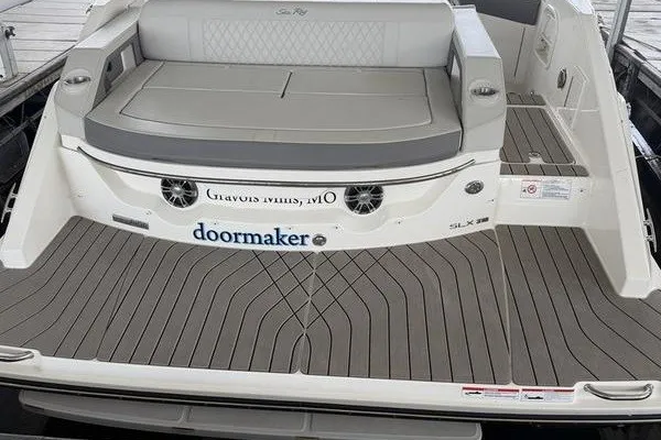Slide: The Image of 2022 Sea Ray SLX 310 boat with spacious seating and sleek design. - 12