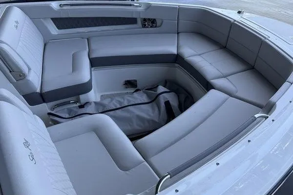 Slide: The Image of Luxurious seating area of a 2022 Sea Ray SLX 310 boat with gray upholstery. - 6