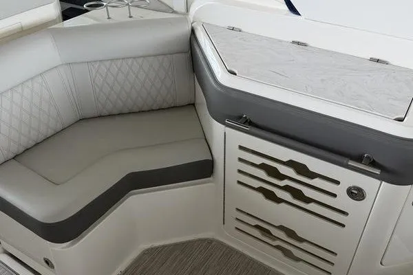 Slide: The Image of 2022 Sea Ray SLX 310 interior with elegant seating and storage. - 9