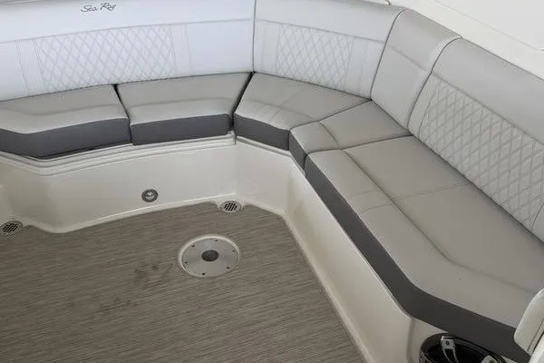 Slide: The Image of Luxurious seating area on a 2022 Sea Ray SLX 310 boat with gray upholstery. - 13