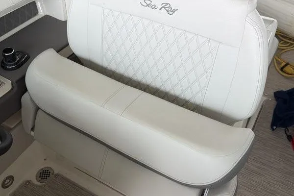 Slide: The Image of Luxurious white seating on 2022 Sea Ray SLX 310 boat with diamond stitching. - 3
