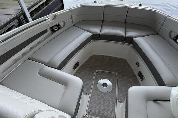 Slide: The Image of 2022 Sea Ray SLX 310 boat interior with spacious seating and modern design. - 10