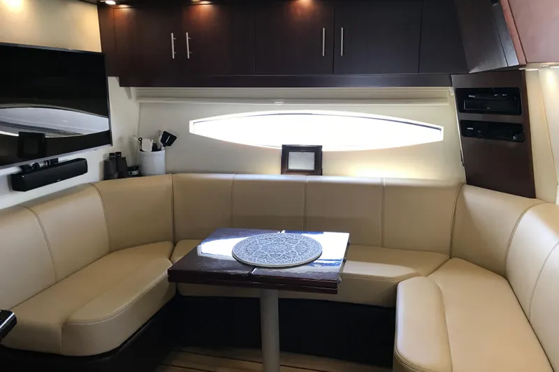 Slide: The Image of Luxurious interior of 2013 Regal 42 Sport Coupe with beige seating and modern amenities. - 27
