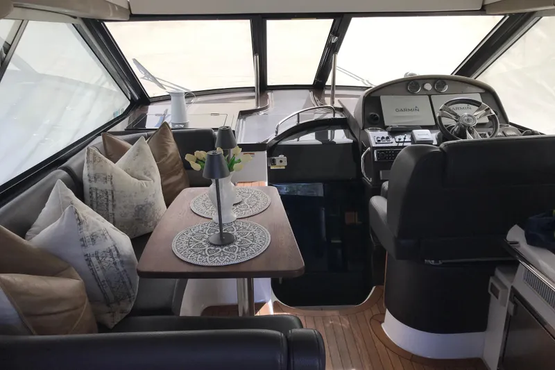 Slide: The Image of Luxurious interior of 2013 Regal 42 Sport Coupe yacht with elegant seating and helm. - 16