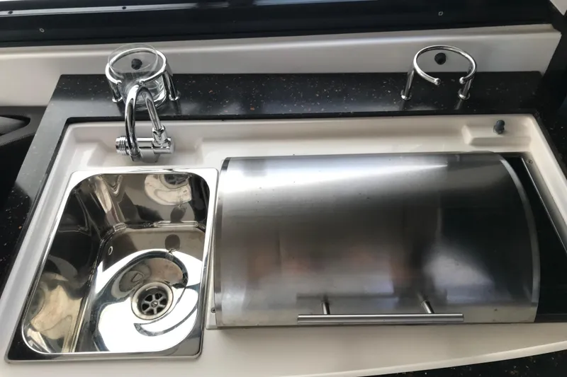 Slide: The Image of Stainless steel sink and cover on 2013 Regal 42 Sport Coupe yacht. - 13