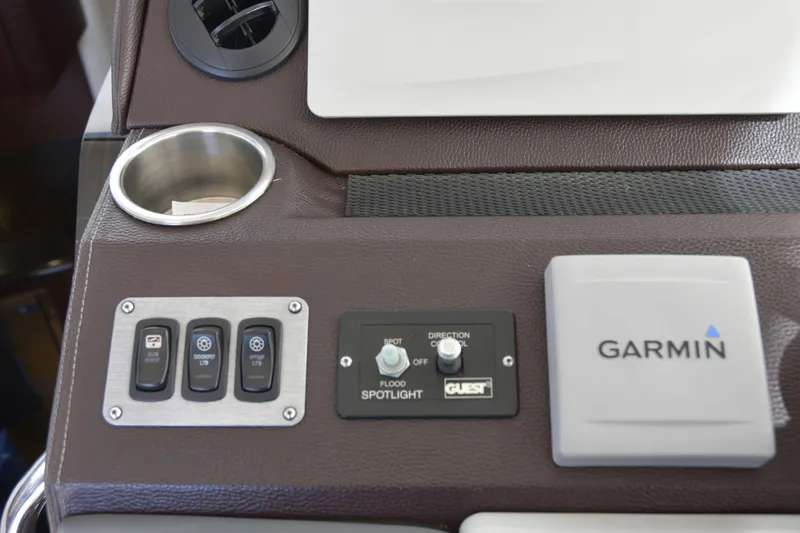 Slide: The Image of Control panel of a 2013 Regal 42 Sport Coupe with Garmin navigation system. - 24