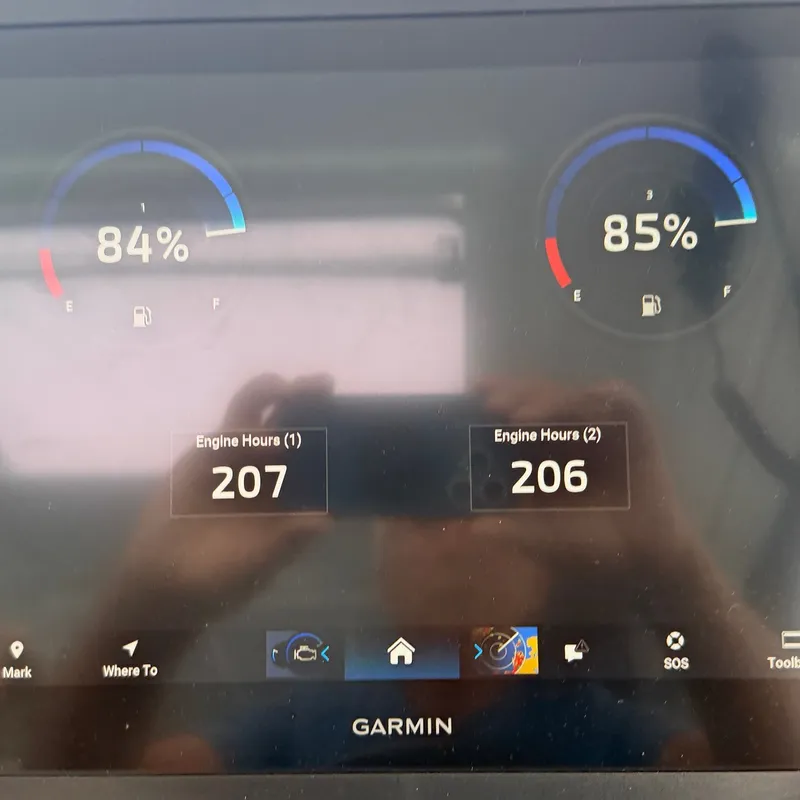 Slide: The Image of Garmin screen displaying fuel levels and engine hours. - 42