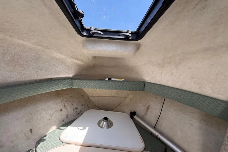 Slide: The Image of Interior cabin of 2002 Bayliner Trophy Walkaround boat with skylight and seating. - 13