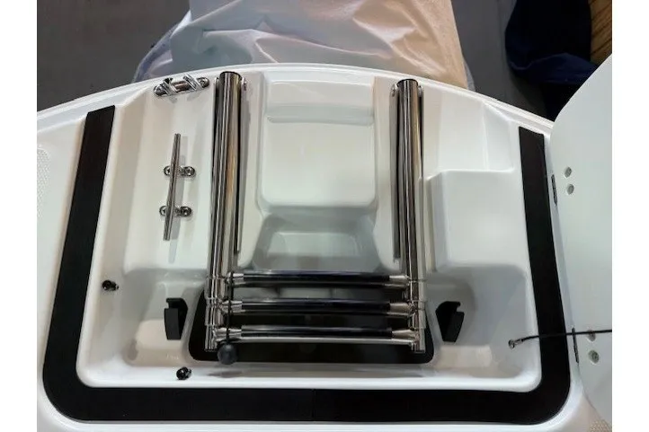 Slide: The Image of 2026 Hurricane SunDeck Sport 2050 OB boat ladder and deck detail. - 24