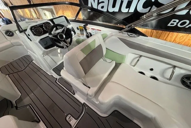 Slide: The Image of 2026 Hurricane SunDeck Sport 2050 OB boat interior with modern dashboard and seating. - 14