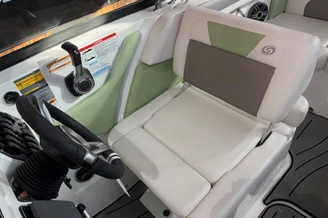 Slide: The Image of 2026 Hurricane SunDeck Sport 2050 OB boat interior with steering wheel and comfortable seating. - 13