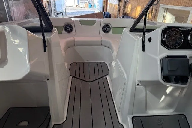 Slide: The Image of 2026 Hurricane SunDeck Sport 2050 OB boat interior with seating and dashboard. - 17