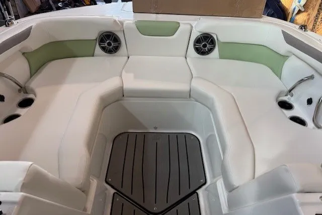 Slide: The Image of Interior view of 2026 Hurricane SunDeck Sport 2050 OB boat with seating and speakers. - 18