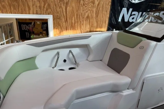 Slide: The Image of 2026 Hurricane SunDeck Sport 2050 OB boat interior with cushioned seating and cup holders. - 19