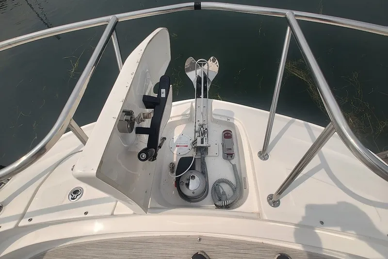 Slide: The Image of 2024 Sea Ray Sundancer 320 Coupe anchor system on deck, featuring stainless steel railings. - 27