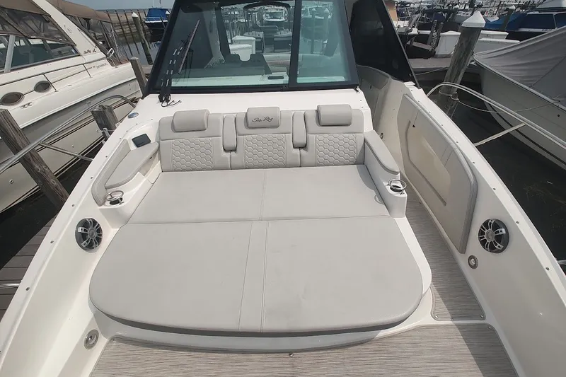 Slide: The Image of 2024 Sea Ray Sundancer 320 Coupe's spacious deck with luxurious seating and modern design. - 26