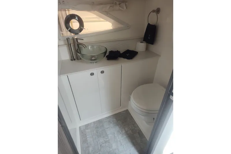 Slide: The Image of Luxurious bathroom in 2024 Sea Ray Sundancer 320 Coupe yacht with modern fixtures. - 35