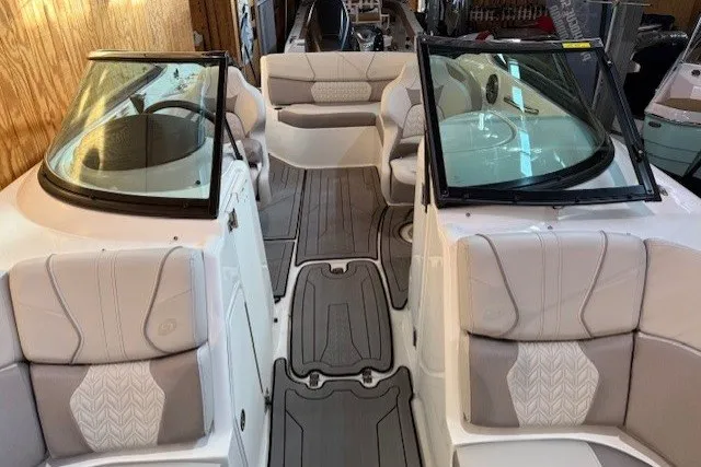 Slide: The Image of 2026 Hurricane SunDeck 2400 OB boat interior with plush seating and modern design. - 16