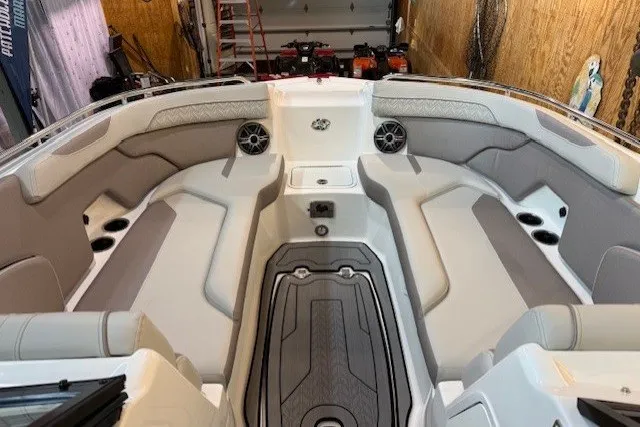 Slide: The Image of 2026 Hurricane SunDeck 2400 OB boat interior with spacious seating and modern design. - 15