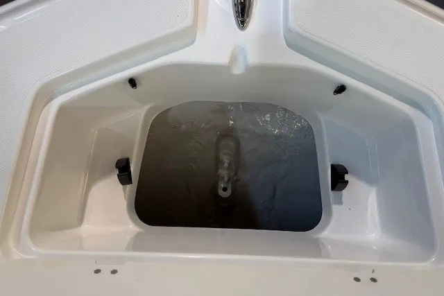 Slide: The Image of 2026 Hurricane SunDeck 2400 OB boat anchor compartment, showcasing storage space and design. - 21