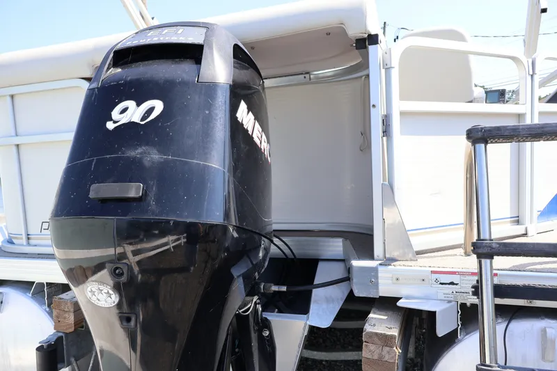 Slide: The Image of 2008 Premier 210 Sunsation pontoon boat with a 90 HP Mercury outboard motor. - 25