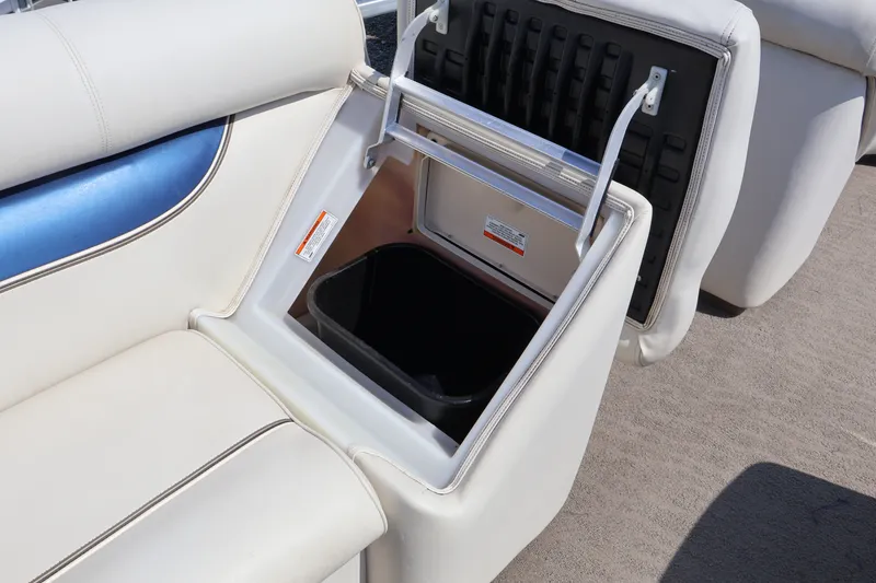 Slide: The Image of Premier 210 Sunsation 2008 boat seat with built-in storage compartment, open to reveal interior. - 34