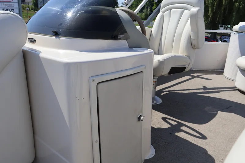 Slide: The Image of 2008 Premier 210 Sunsation boat interior with helm and seating area. - 43