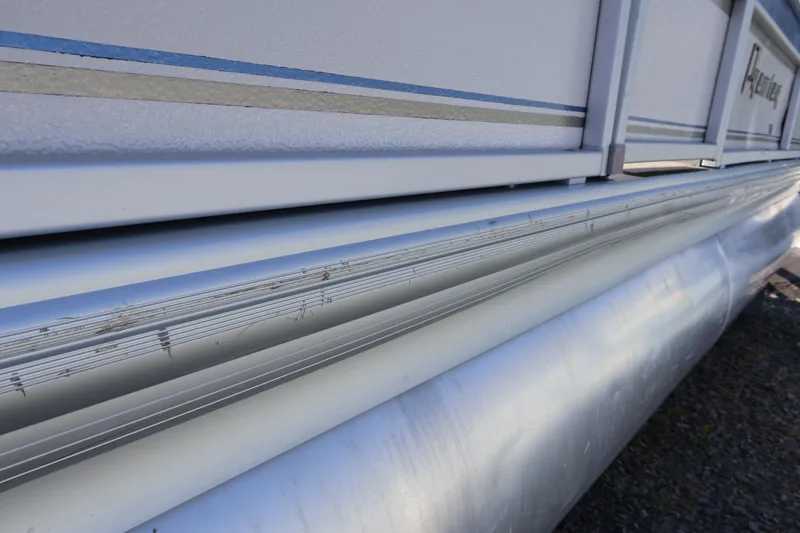 Slide: The Image of Close-up of a 2008 Premier 210 Sunsation pontoon boat's aluminum side and pontoon. - 3