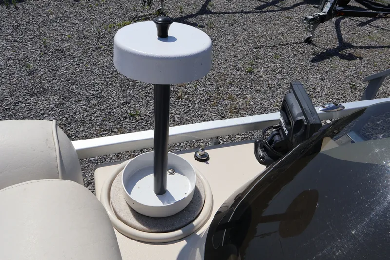 Slide: The Image of 2008 Premier 210 Sunsation boat detail with a mounted device and seating area. - 59