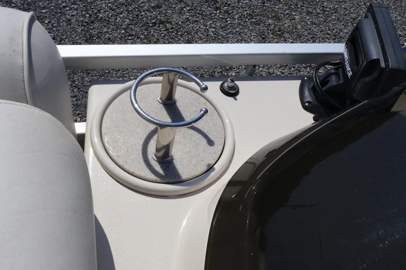 Slide: The Image of 2008 Premier 210 Sunsation boat console with cup holder and electronic device. - 52