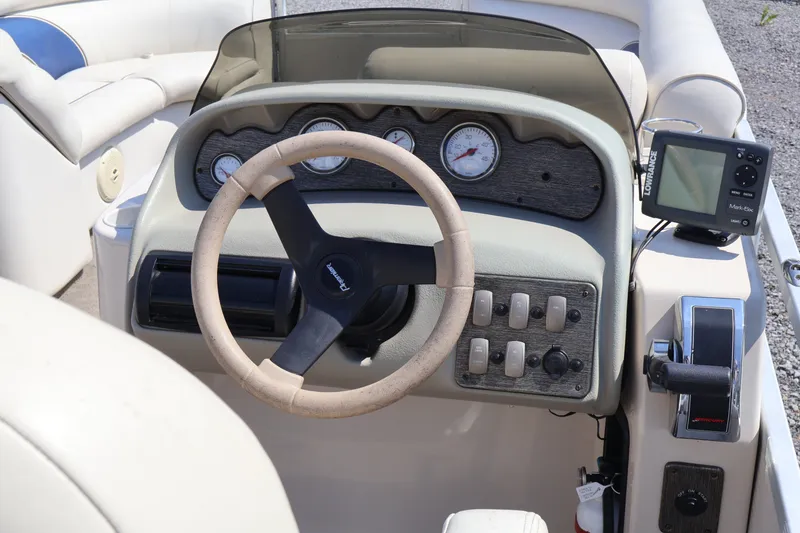 Slide: The Image of Steering console of a 2008 Premier 210 Sunsation boat with gauges and controls. - 38