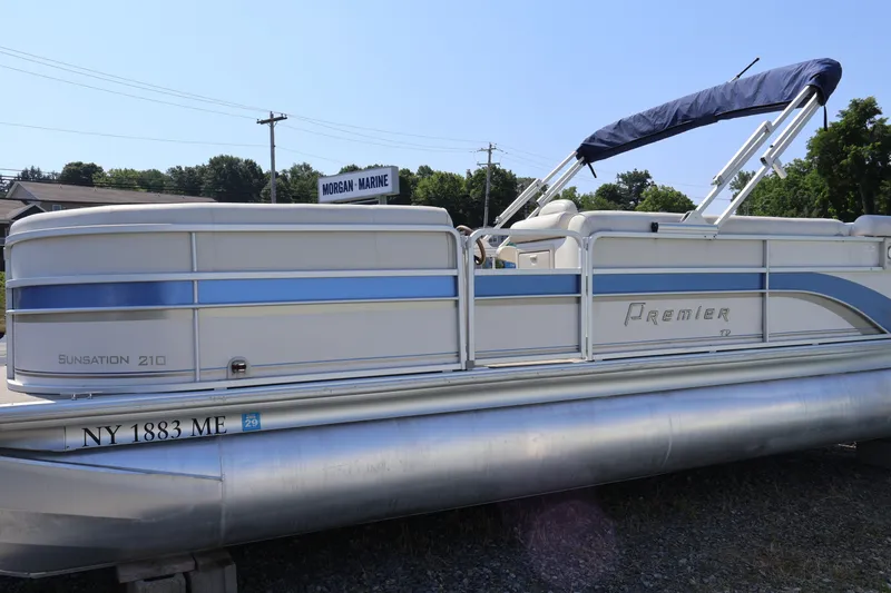 Slide: The Image of 2008 Premier 210 Sunsation pontoon boat with blue accents, parked at Morgan Marine. - 1